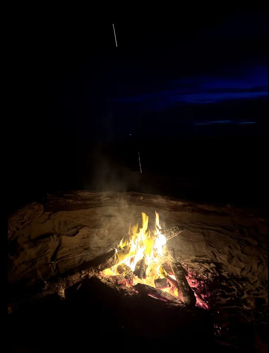 Beach bonfire at blue hour