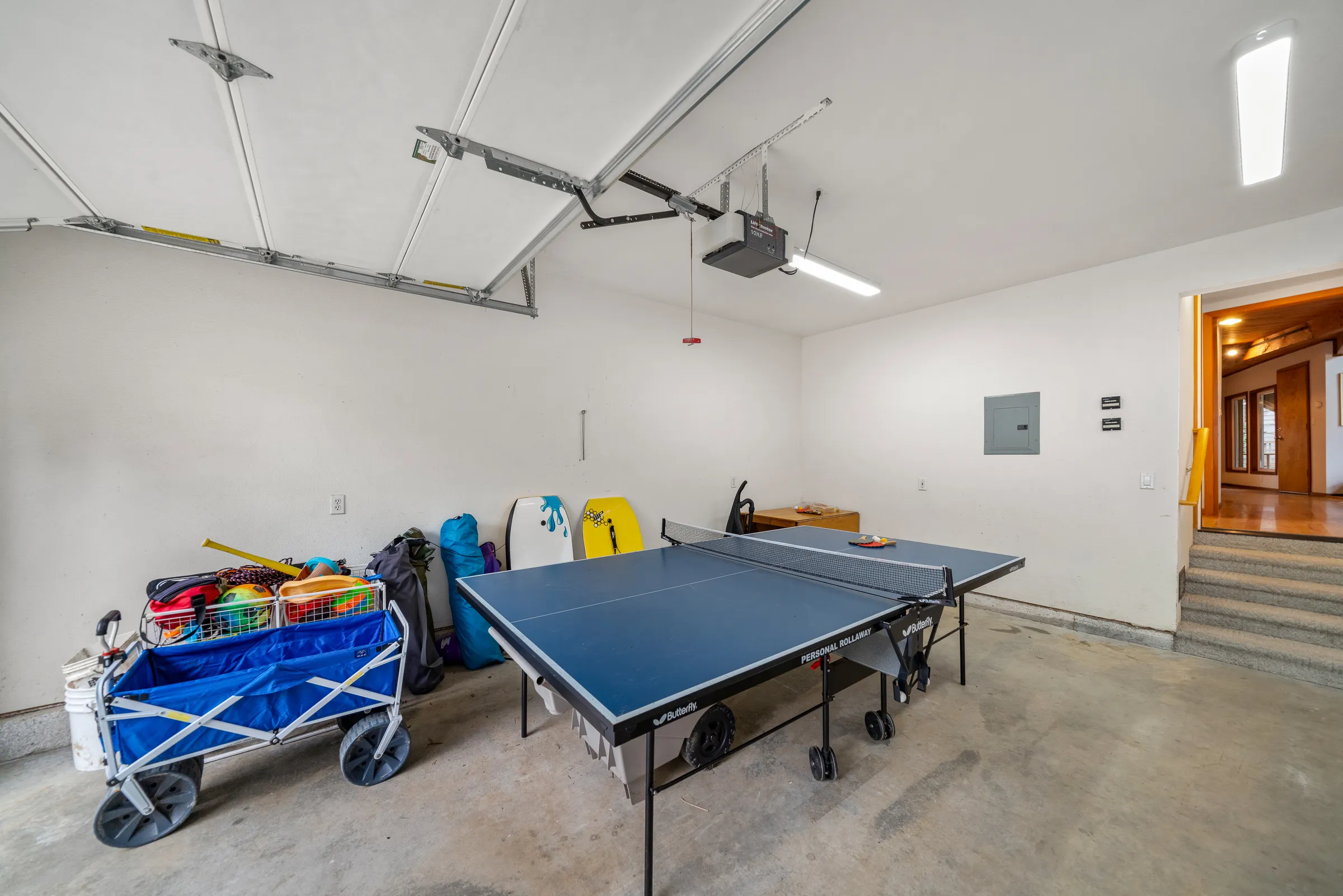 Ping pong table, beach wagon, and boogie boards